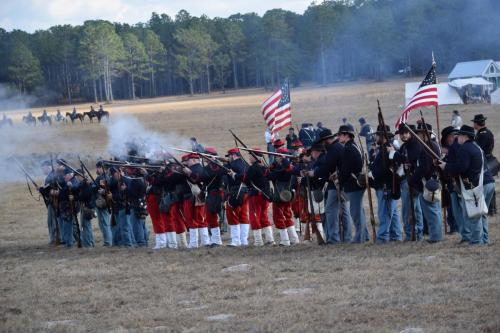 38th Brooksville Raid Civil War Re-enactment. Soldiers lining up on the battlefield displaying their gun fire.